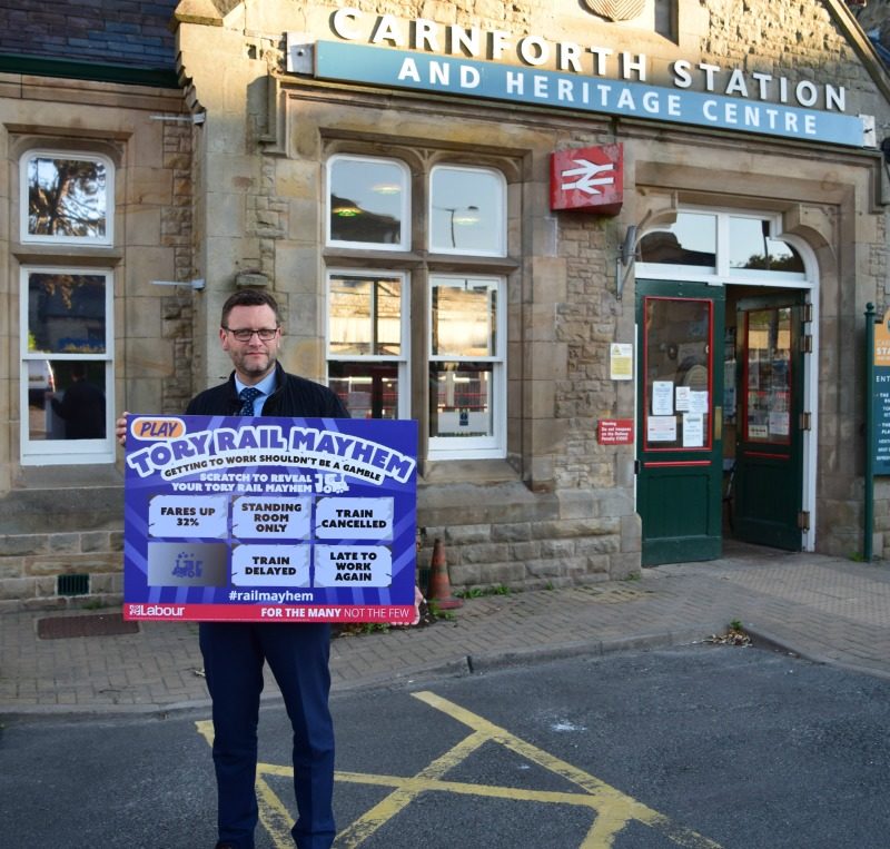 City Councillor John Reynolds campaigning at Carnforth Railway Station